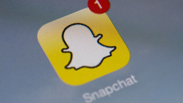 The logo of mobile app Snapchat is displayed on a tablet on January 2, 2014 in Paris. - Sputnik Türkiye