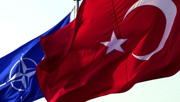 A Turkish flag waves in front of NATO's one - Sputnik Türkiye