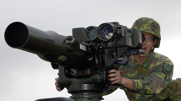A military soldier operates a TOW anti-tank missile launcher. File photo - Sputnik Türkiye