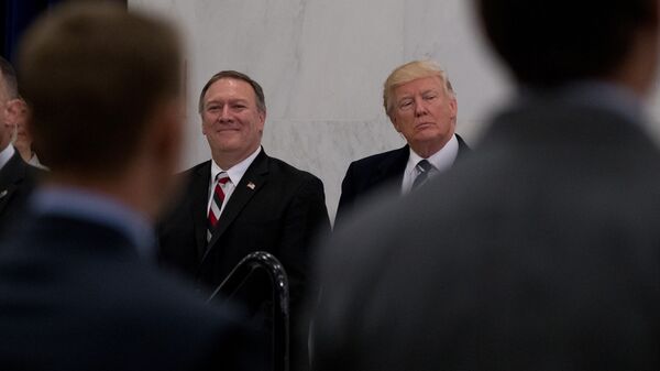 President Donald Trump, accompanied by CIA Director-designate Rep. Michael Pompeo, left, waits to speak at the Central Intelligence Agency in Langley, Va., Saturday, Jan. 21, 2017 - Sputnik Türkiye