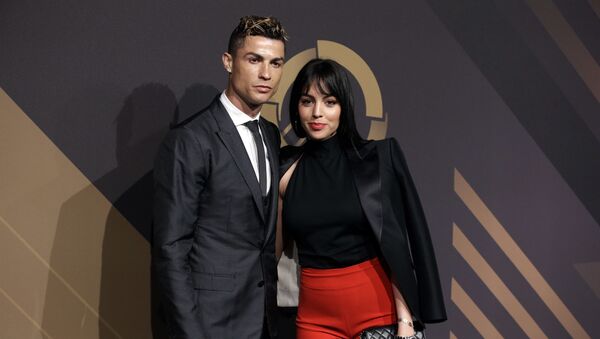 In this March 19, 2018 file photo, Real Madrid player Cristiano Ronaldo and his girlfriend Georgina Rodriguez pose for photos as they arrive for the Portuguese soccer federation awards ceremony in Lisbon - Sputnik Türkiye