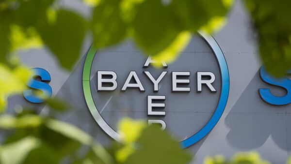 This file photo taken on July 24, 2013 shows a logo of German pharmaceuticals and chemicals giant Bayer on an overpass at its Berlin headquarters - Sputnik Türkiye